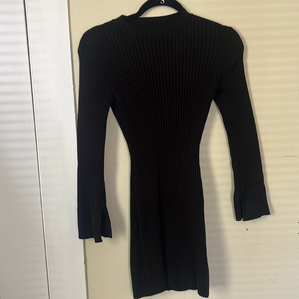 Black knit ribbed short long sleeve sweater dress.